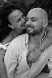 Captured in timeless black and white, a joyous embrace at the beach villa. Fine art photography that speaks love and connection.