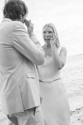 wiping happy tears, candid moment between bride and groom during an intimate Akumal wedding