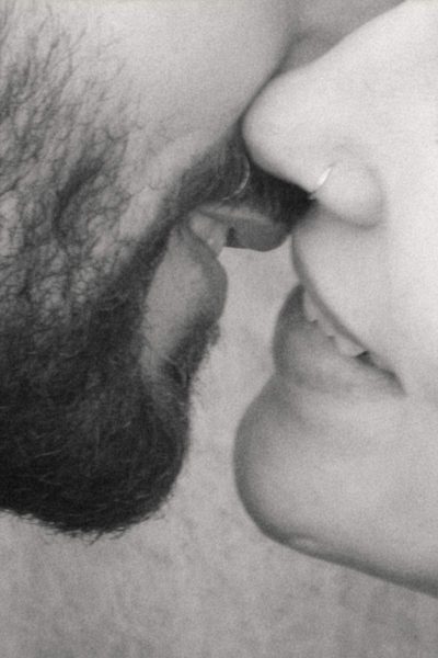 extreme close up of bride and groom lips shot in black and white, vintage feel film look wedding photography
